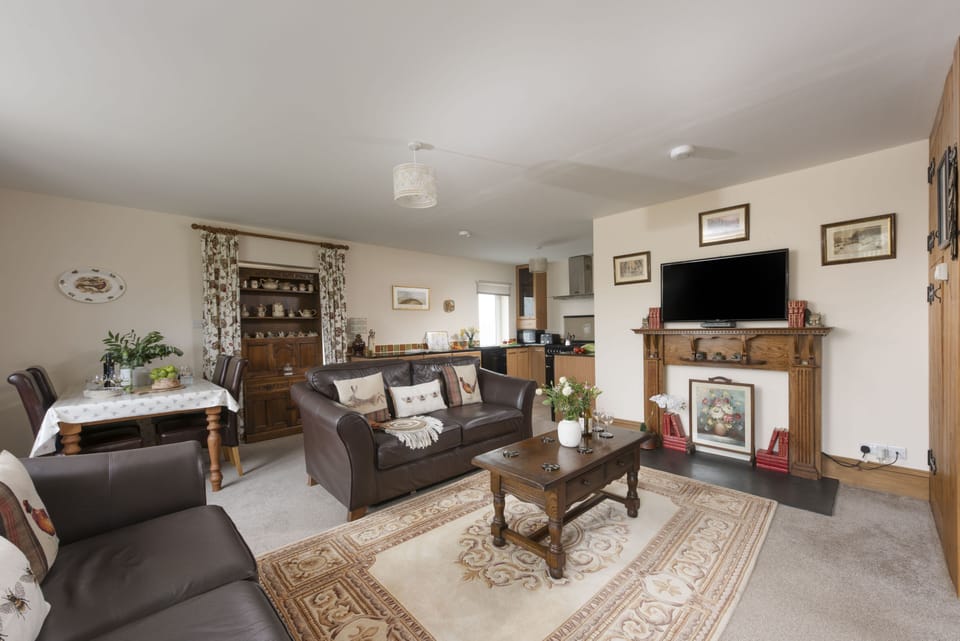 Honeycomb Cottage, Perranporth: Thoughtfully designed with modern amenities and charming interiors, Honeycomb Cottage features a homely open-plan living space.