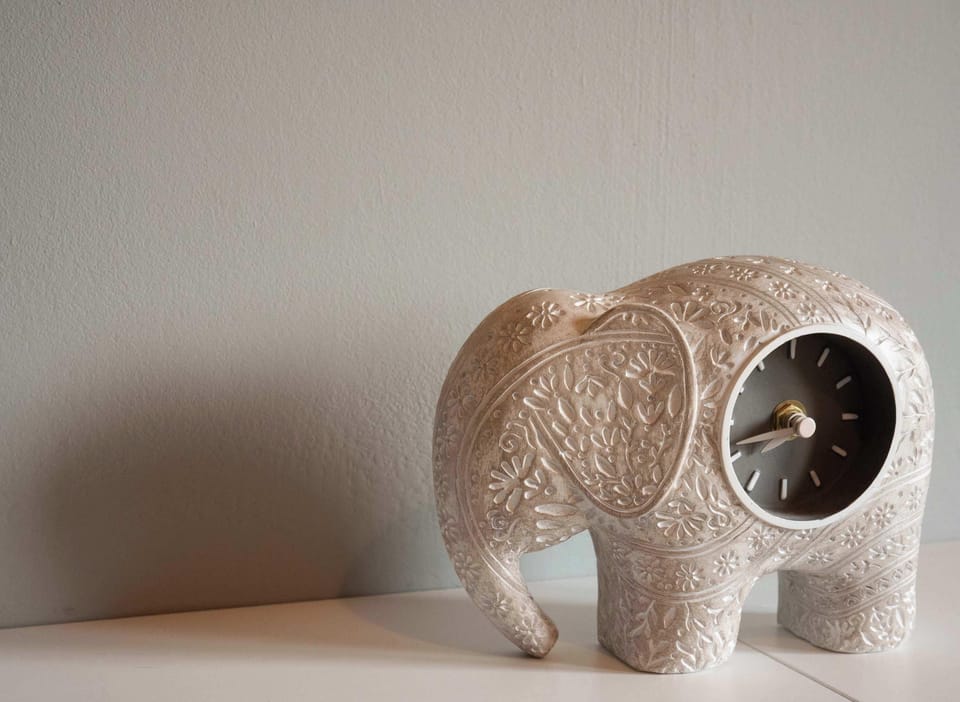 Refined décor touches like this artisan elephant clock elevate your stay — where luxury meets personality in every corner.
