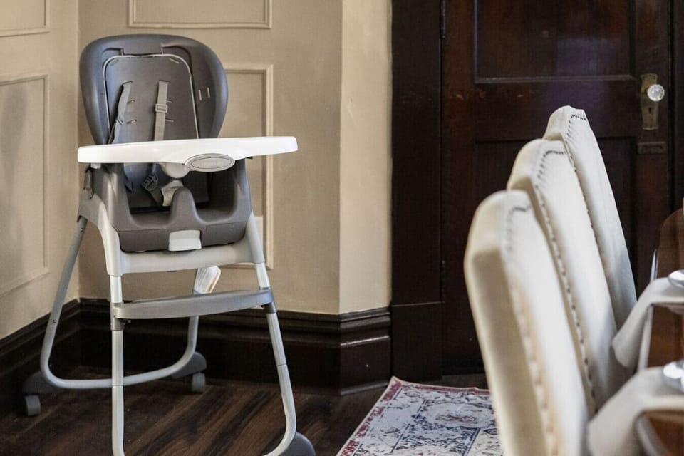 Family-Friendly, Thoughtfully Equipped – A clean, modern high chair is tucked nearby so even your littlest guests can join the table with ease and comfort.