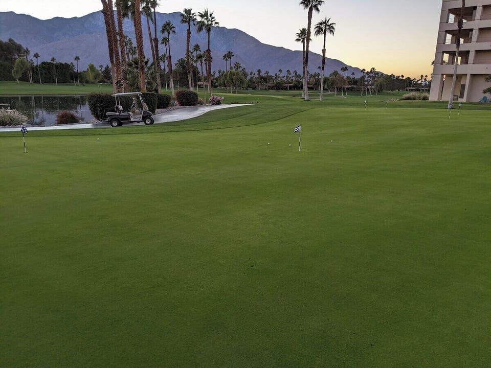 Tee off at sunset on lush greens with mountain views—a golfer's dream awaits