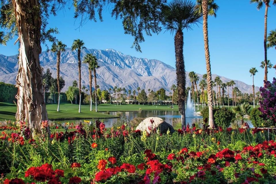 Postcard-perfect golf course, fountains & snowcapped mountains right outside