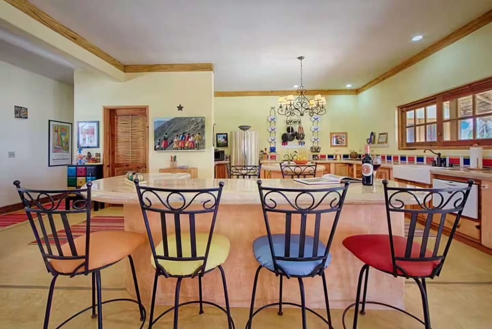 Large kitchen with plenty of seating for conversation while cooking meals