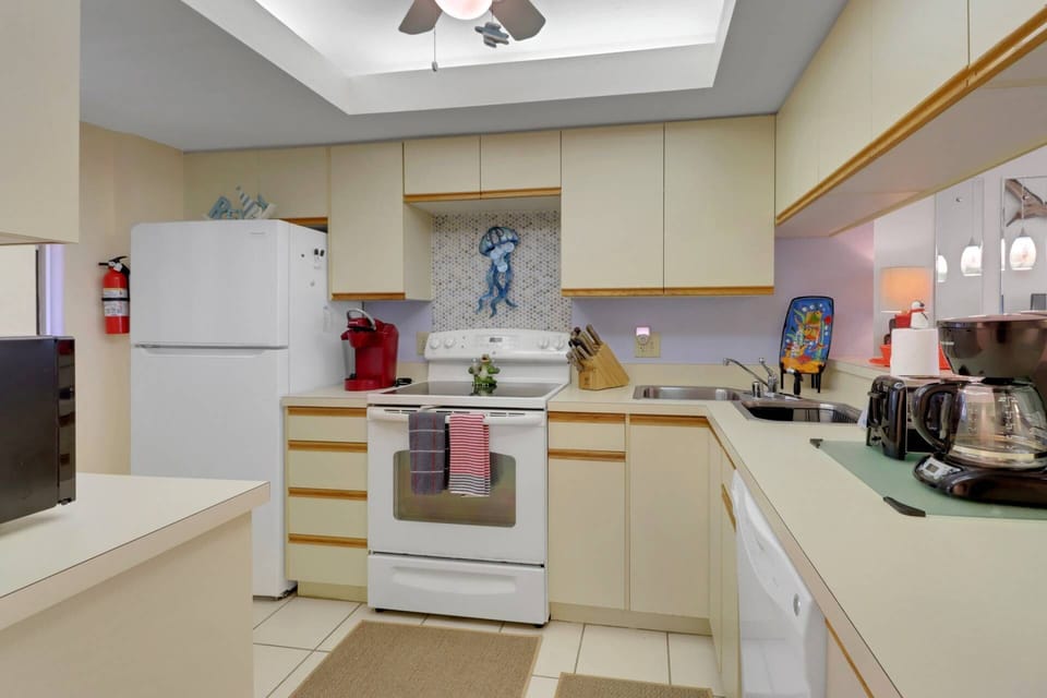 The full kitchen features refrigerator/freezer, stove, microwave and dishwasher.