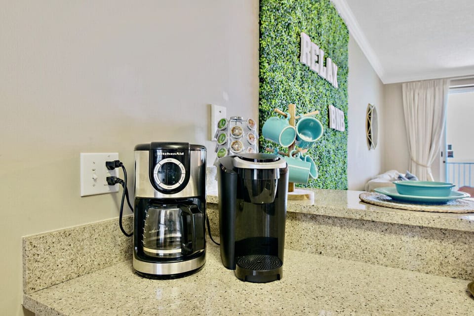 Start your morning right with a choice of fresh brewed or single-serve coffee, perfectly set up in this stylish and inviting kitchen nook