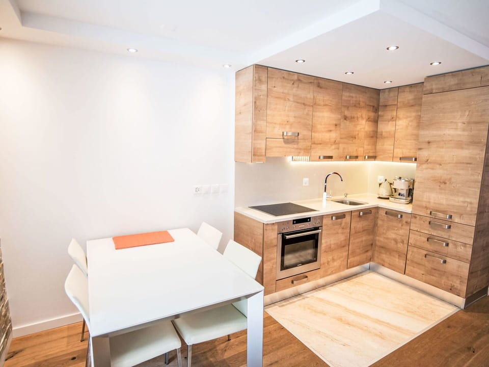 Furniture, Flooring, Kitchen, Countertop, Interior Design, Cabinetry, Wood, Floor, Kitchen Appliance, Wood Flooring