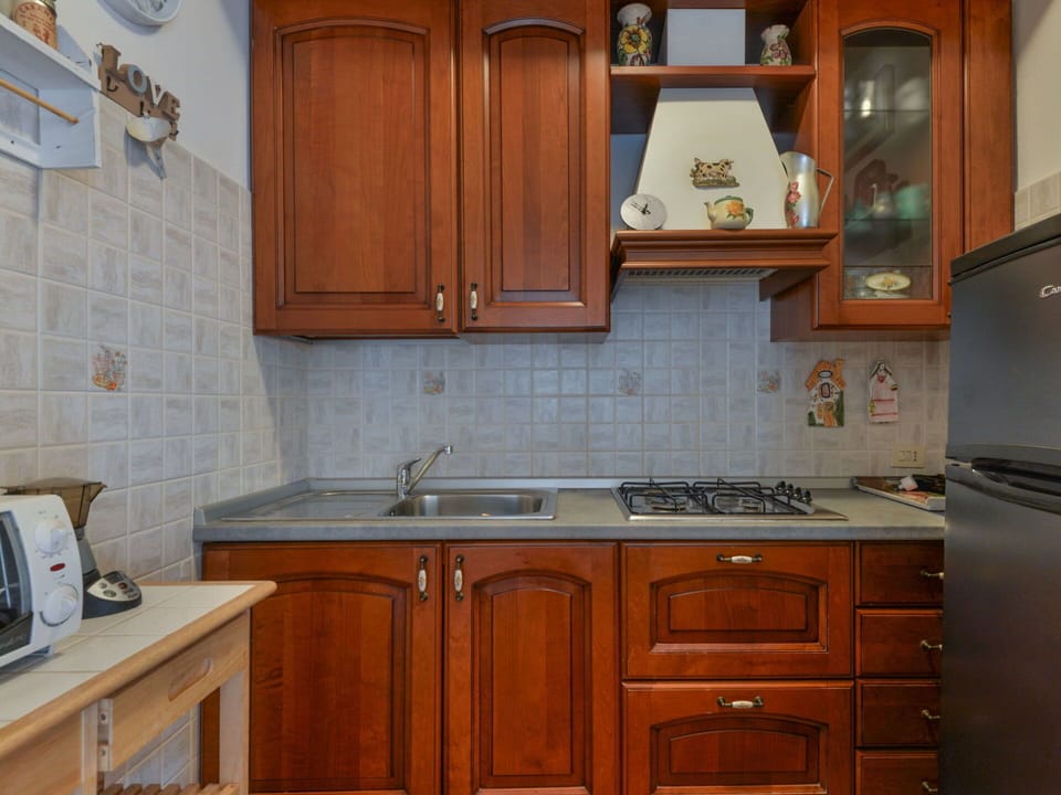 Kitchen, Kitchen Appliance, Major Appliance, Wood, Countertop, Cabinetry, Flooring, Interior Design, Kitchen Sink, Stove