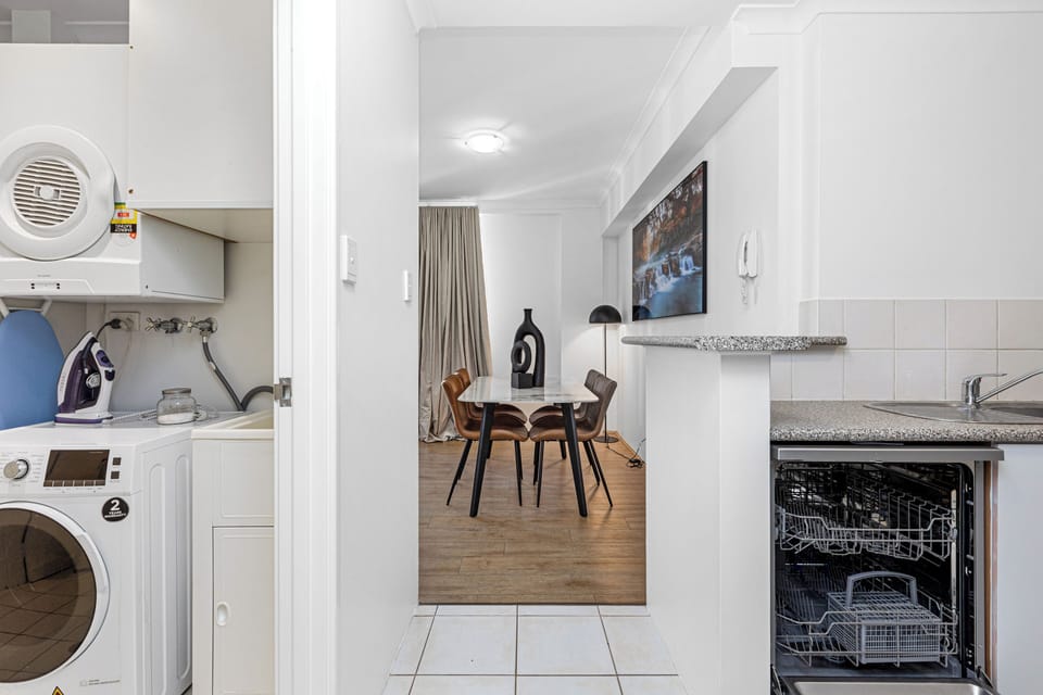 Experience seamless living with convenient access to laundry and kitchen facilities, designed for efficient daily routines.