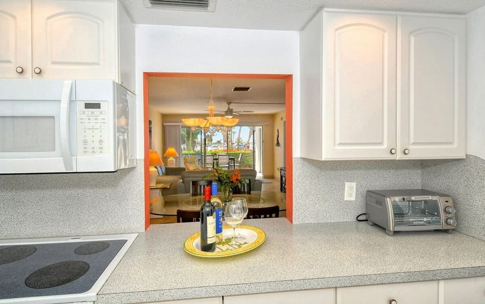 Kitchen - Pass-through to dining area.