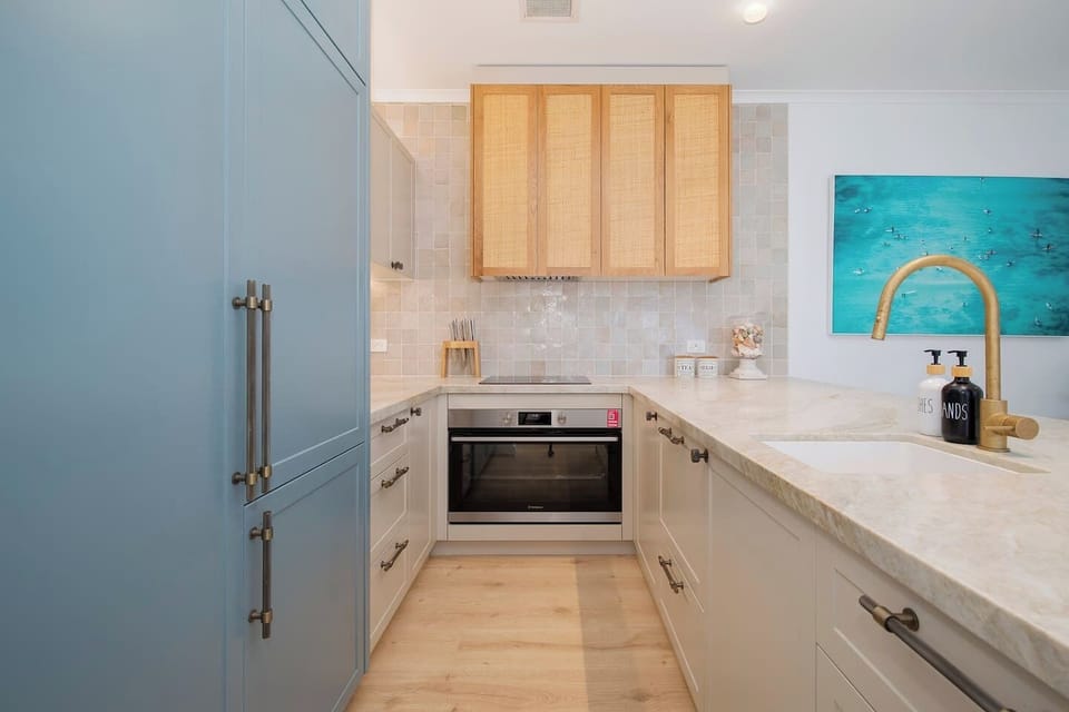 Prepare fresh seafood straight from the local markets in this fully equipped kitchen, featuring an oven, espresso machine and a stone bench top.