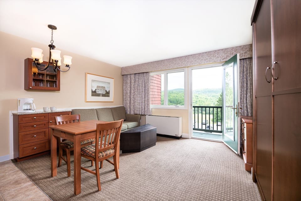 Spacious dining area with large windows, offering a bright setting to enjoy meals and gather with loved ones.