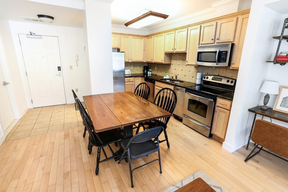 Well-appointed kitchen with modern appliances and a dining area, perfect for enjoying meals together.