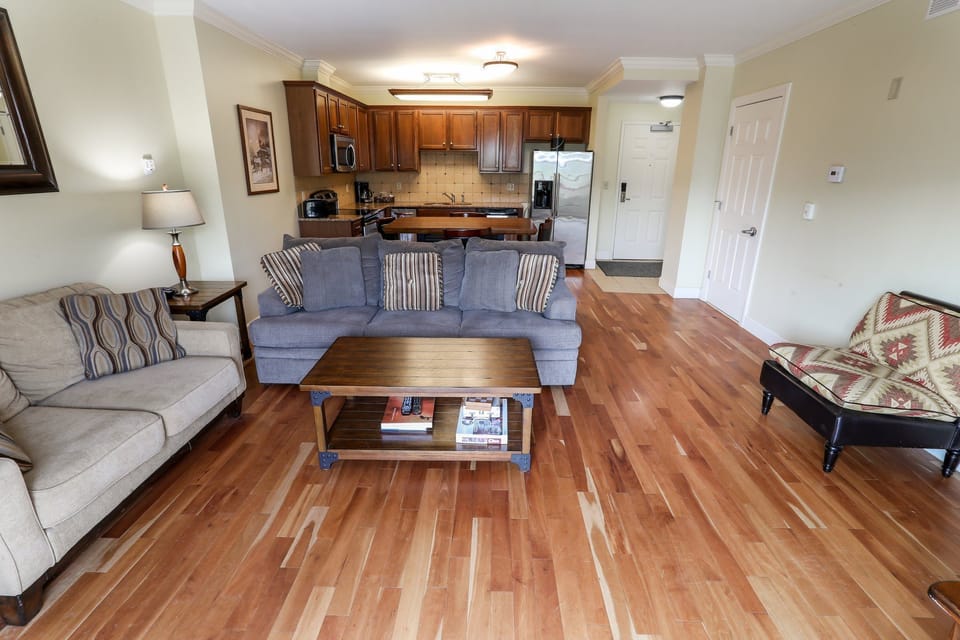 Comfortable living room with plenty of seating, ideal for gathering with family or friends.