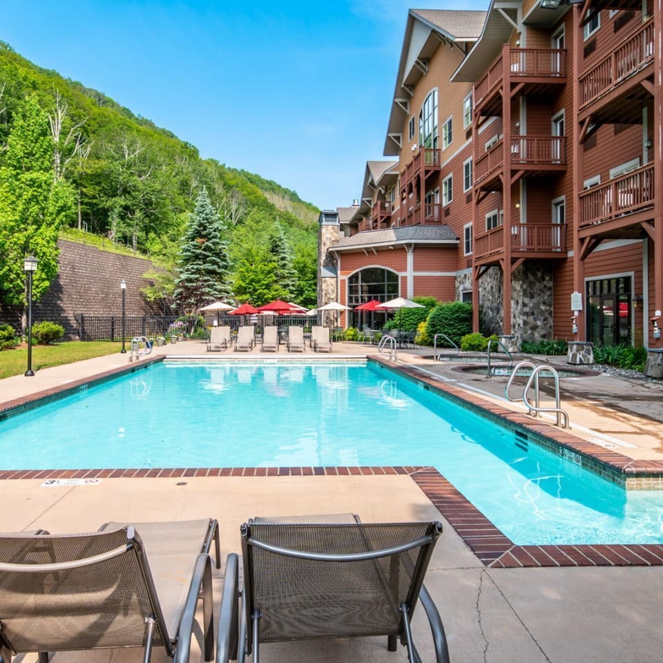 Serene poolside escape with mountain views, the perfect place to soak up the sun and unwind.