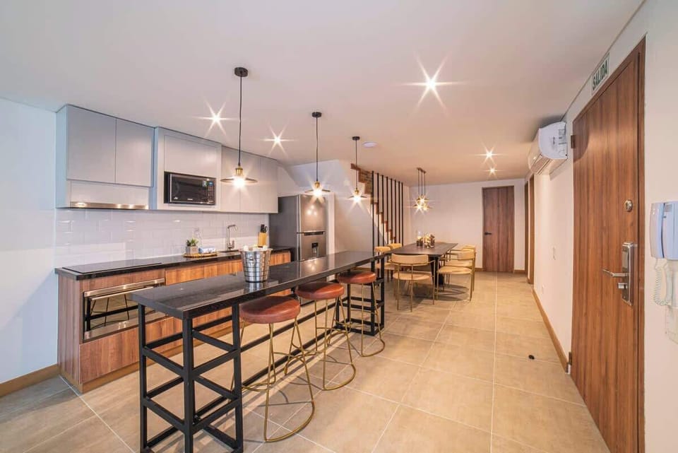 Open kitchen that connect to living room and dining table