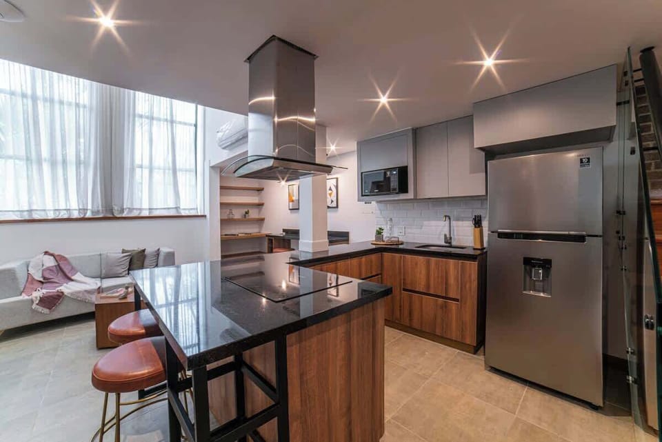 Full kitchen with bar chairs to keep the cook entertained.