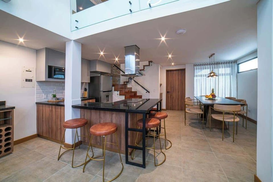 Open kitchen with option to sit in bar or at the dining table.