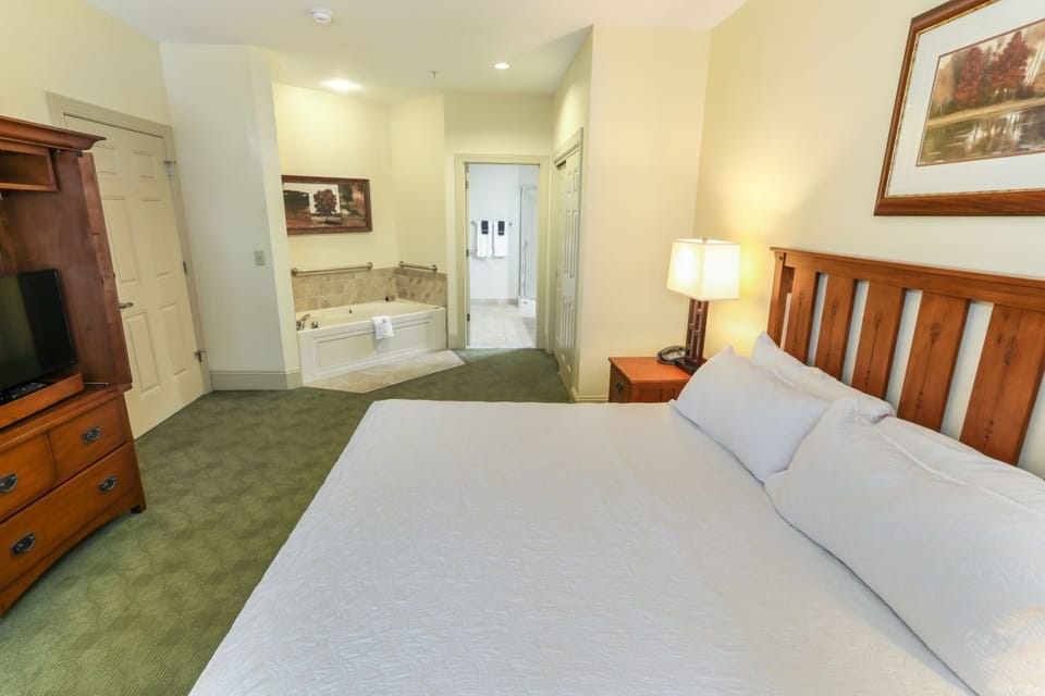 Elegant bedroom with a private Jacuzzi just steps away, creating the ultimate relaxation experience.