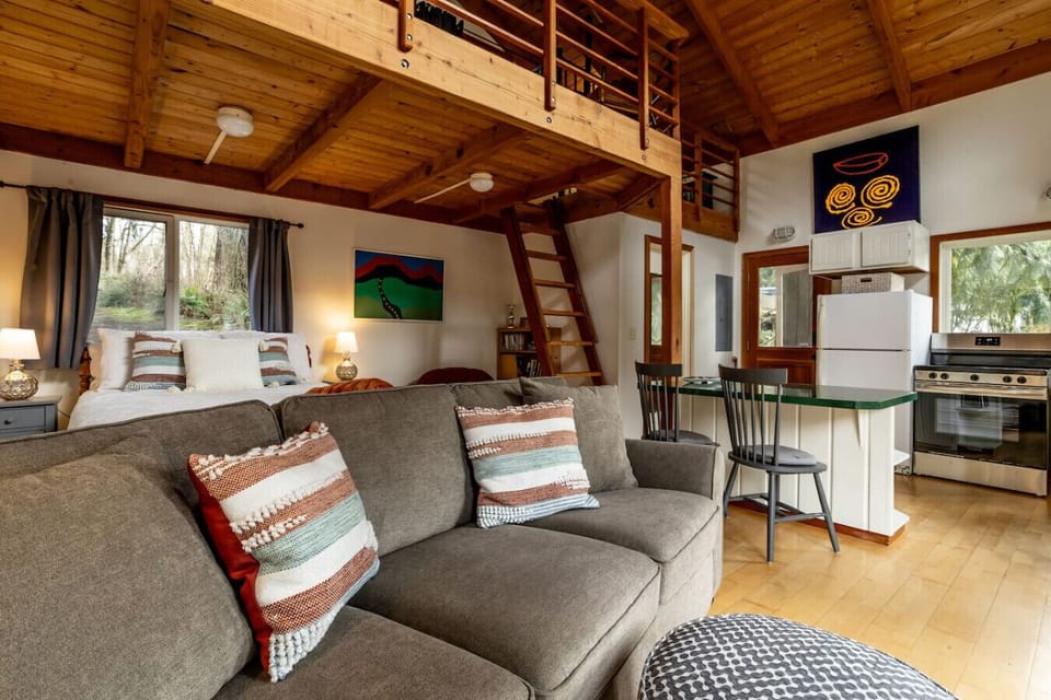 The couch is in the main area of the space so everyone can continue to enjoy their time together.