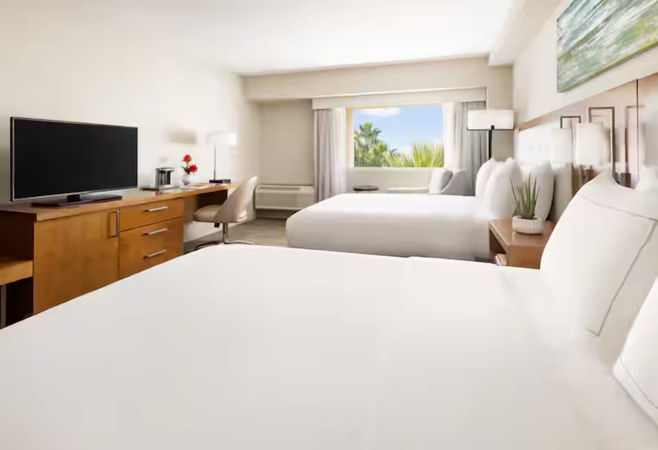 Enjoy a quiet, sunlit stay with comfortable beds and views.