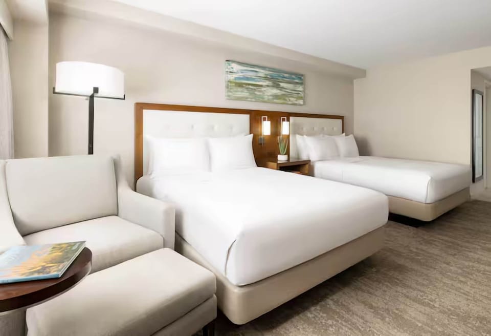 Stretch out with two plush beds and a cozy sitting nook.