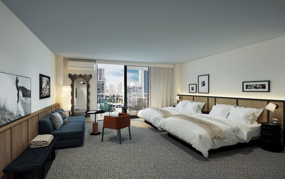 Unwind in a bright studio bedroom with skyline views.