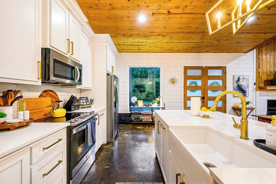 The bright and airy kitchen is equipped for all your cooking needs