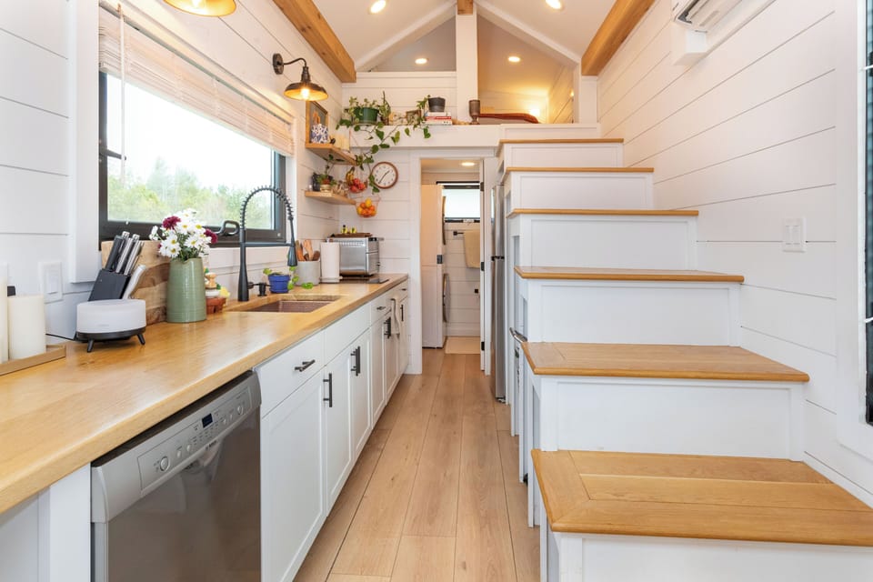 View of kitchen leading into the primary loft and bathroom.