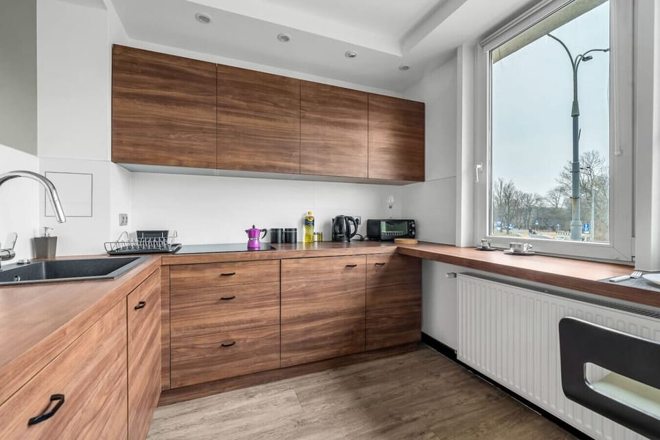 Living Room with Kitchen & Stunning National Stadium View | Book Now with RENTUJEMY.COM