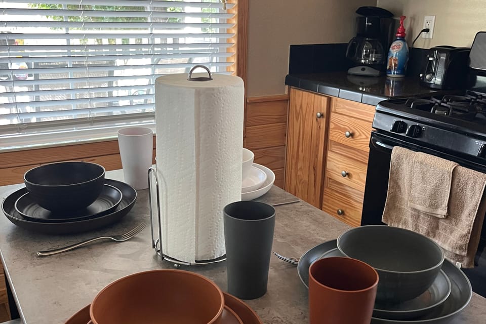 Kitchen with coffee and 6 sets of all kitchen ware 
