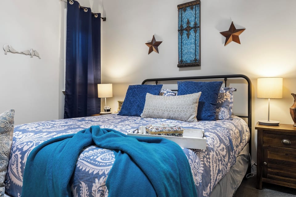 Bedroom 2: Serenity Twilight Room offers a cozy queen bed with fairy-tale charm