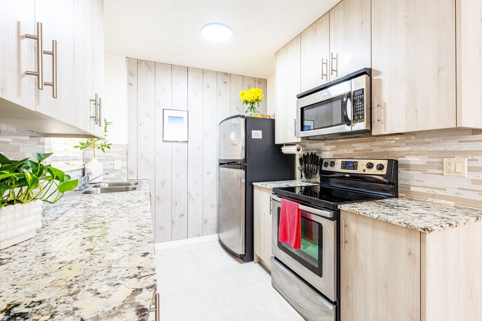 Indulge in a chef-worthy kitchen featuring high-end appliances