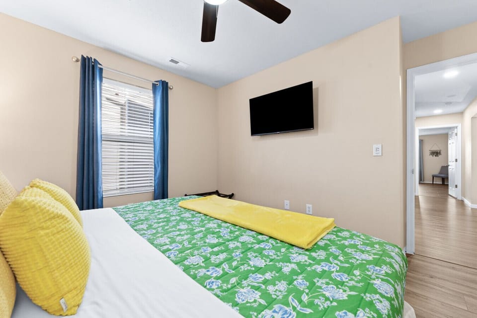 Second king bedroom with a memory foam mattress, steps from the hall bath. Room-darkening shades help with early bedtimes.