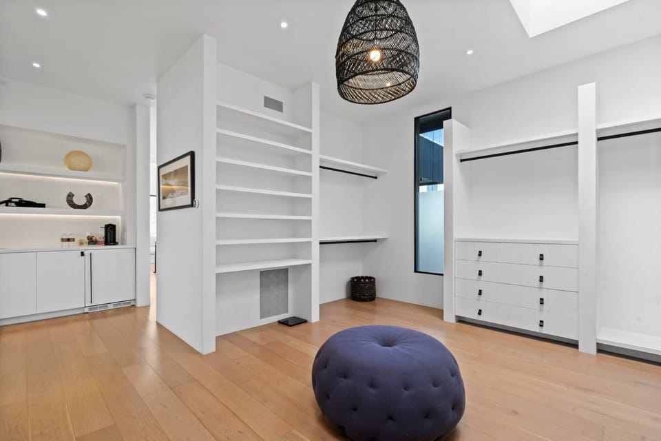 An elegant walk-in closet where everything has its perfect place.