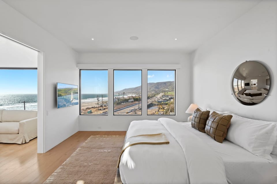 A serene bedroom sanctuary where the horizon greets you each morning.