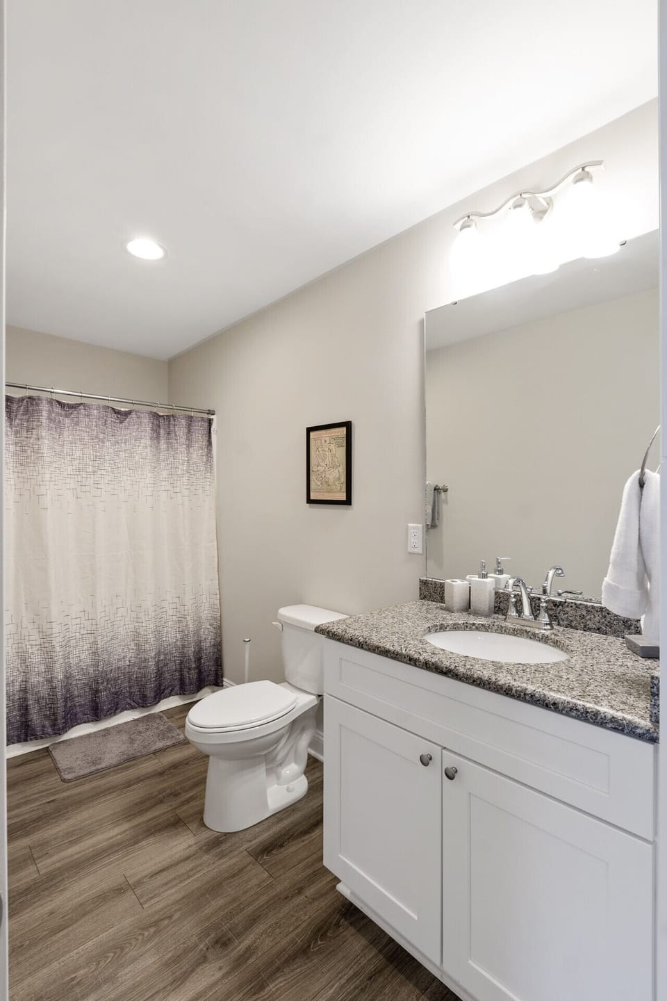 A well-appointed bathroom with a full-size tub and elegant finishes for relaxation.