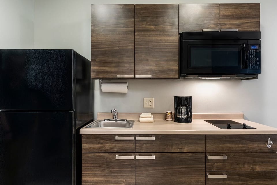 Make simple meals with microwave, fridge, and easy clean counters.