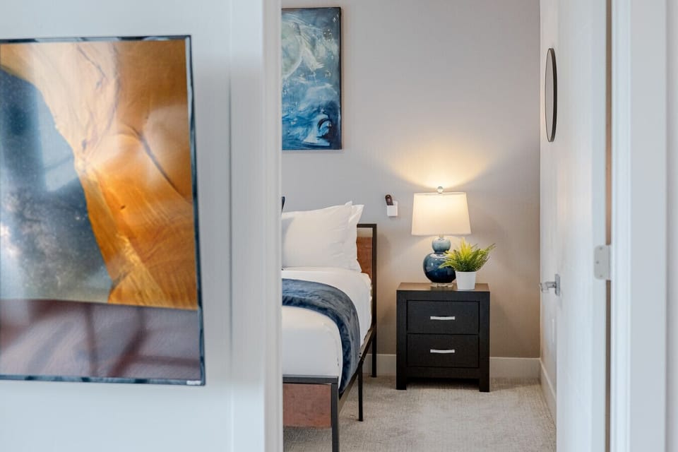 Beautifully designed bedroom. Luxury King mattress. 55`TV with local art.