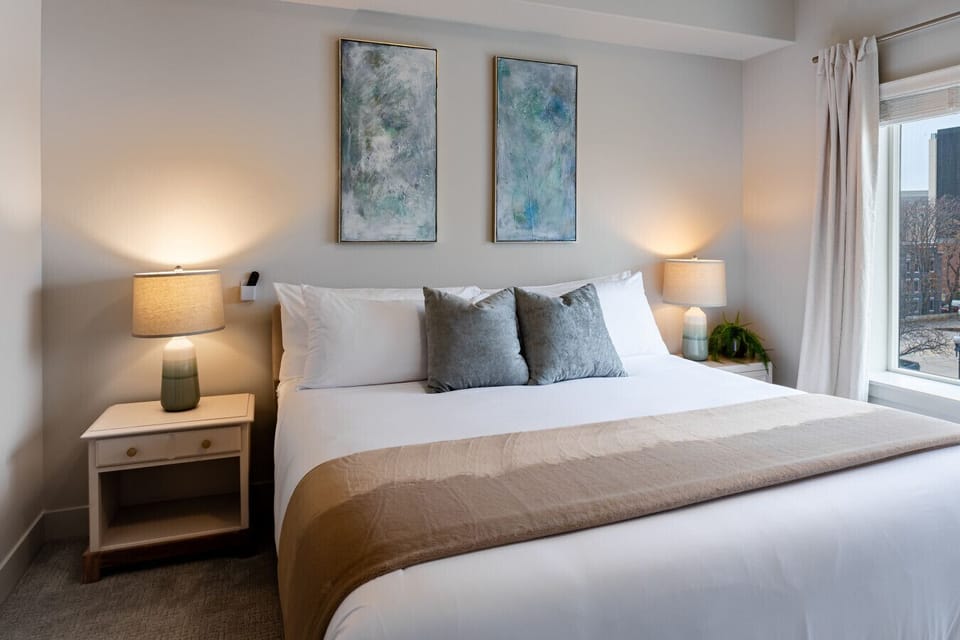 Primary Bedroom Luxury King mattress, ensuite bathroom, 55” TV with local art.