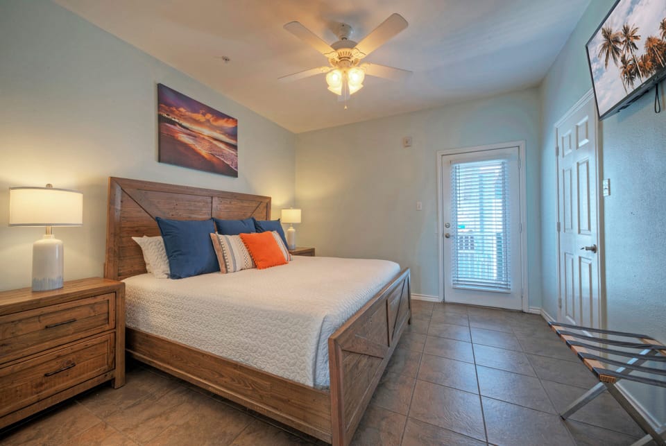 The bedroom features a king bed, TV, and an ensuite bathroom. (Costa Bahia 205)