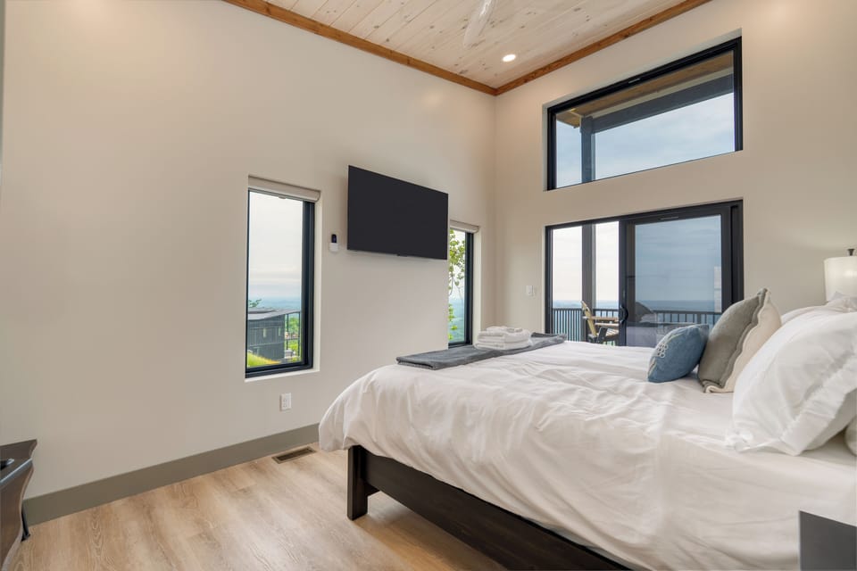 Bedroom 2 features a king bed and an ensuite bathroom.