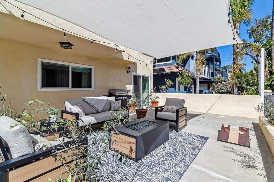 The 1000 sf patio, partially shaded w/ a firepit, BBQ, large dining table, games and multiple seating areas also features amazing evening lighting for enjoying the best of the the Venice beach life! 