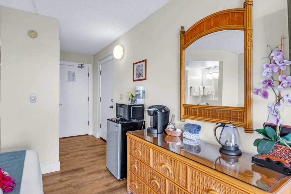 Room features a mini-fridge, microwave, Keurig and an electric tea kettle.