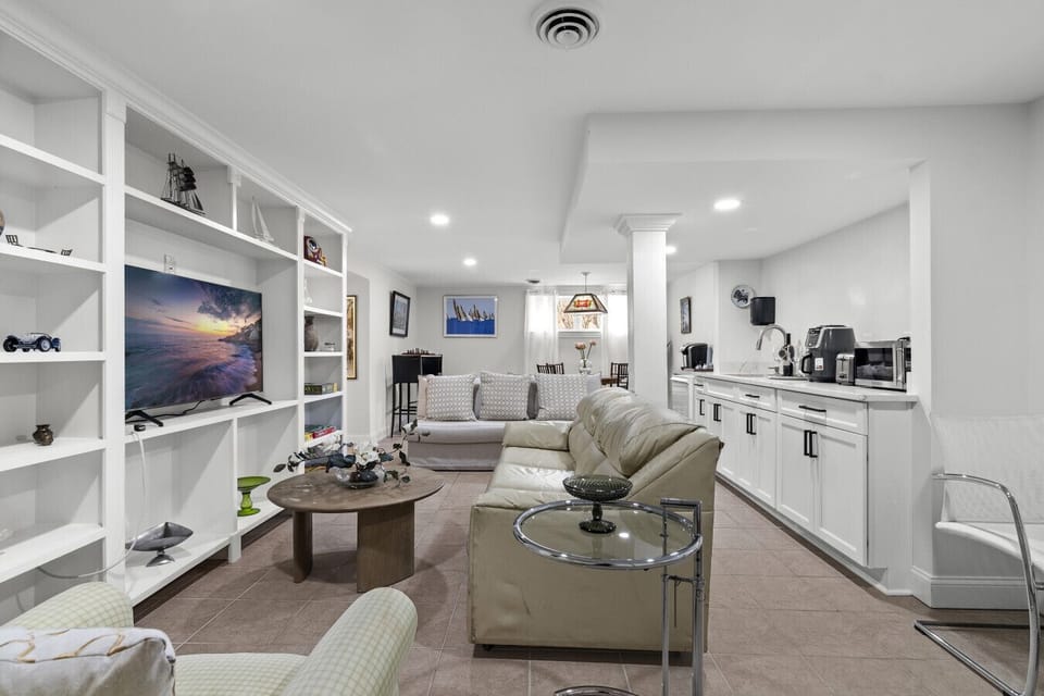 "Relax and recharge in the cozy living room, featuring a full sleeper sofa and Smart TV for a comfortable stay.