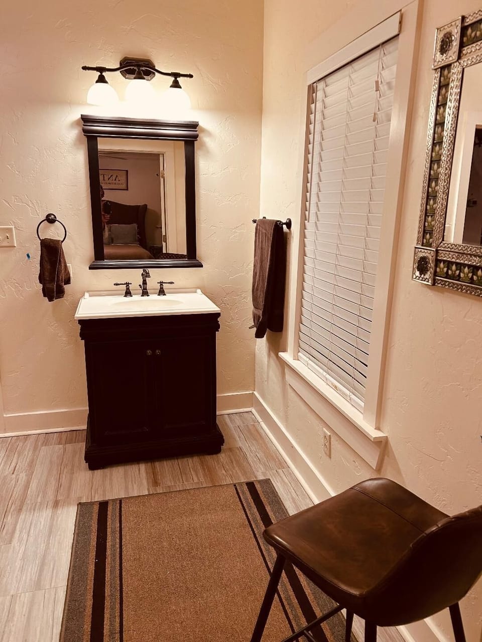 Middle Bath: full bathroom with sitting area for getting ready.