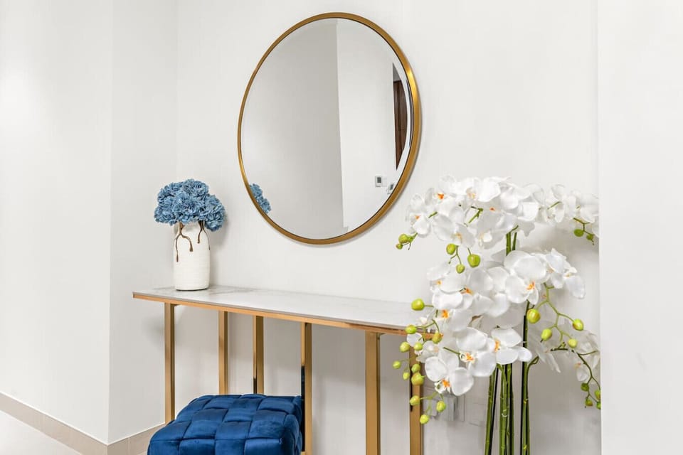 Entrance Hall: Stylish decor and vibrant blooms welcome you to your Dubai getaway!
