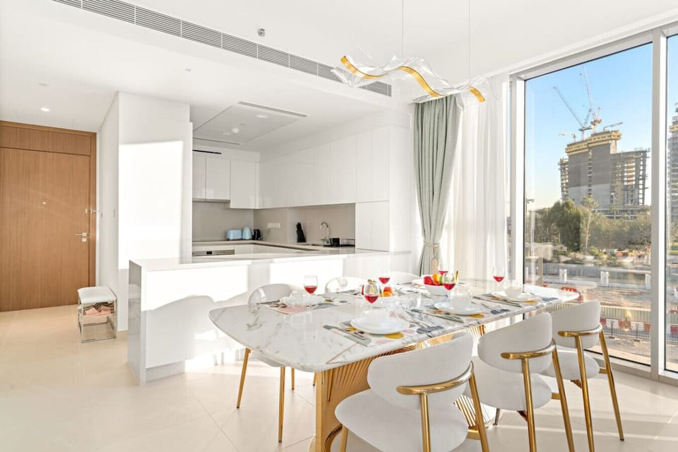 Dining Area: Elegant marble table invites delightful meals with city views! Enjoy your stay!