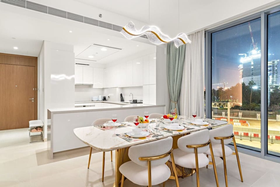 Dining Room: Dine in style with a sleek marble table and stunning city views after sunset!