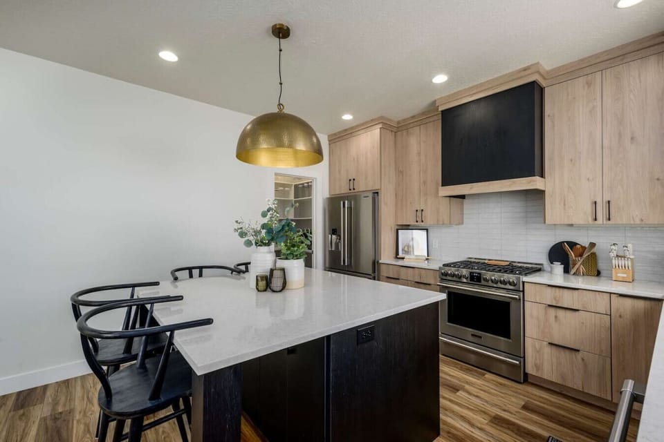 Fully equipped kitchen with sleek appliances and island seating