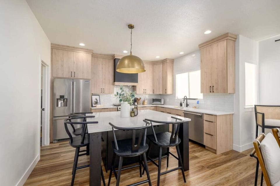 Modern kitchen and dining area with seating for six
