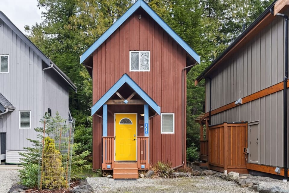 Welcome to your cozy Ucluelet retreat! A charming brown townhouse with easy parking right out front.